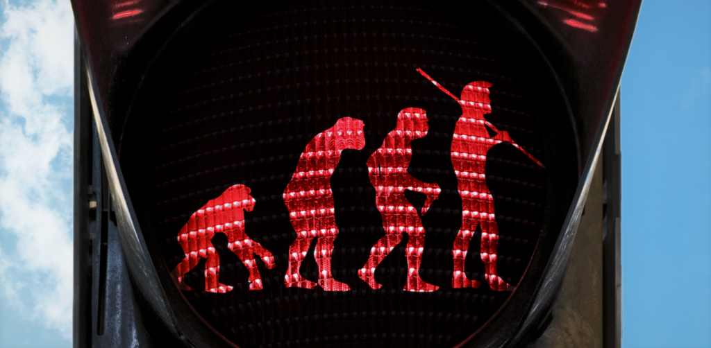 Ihmisen evoluutio apinasta lähtien punaisessa liikennevalossa.